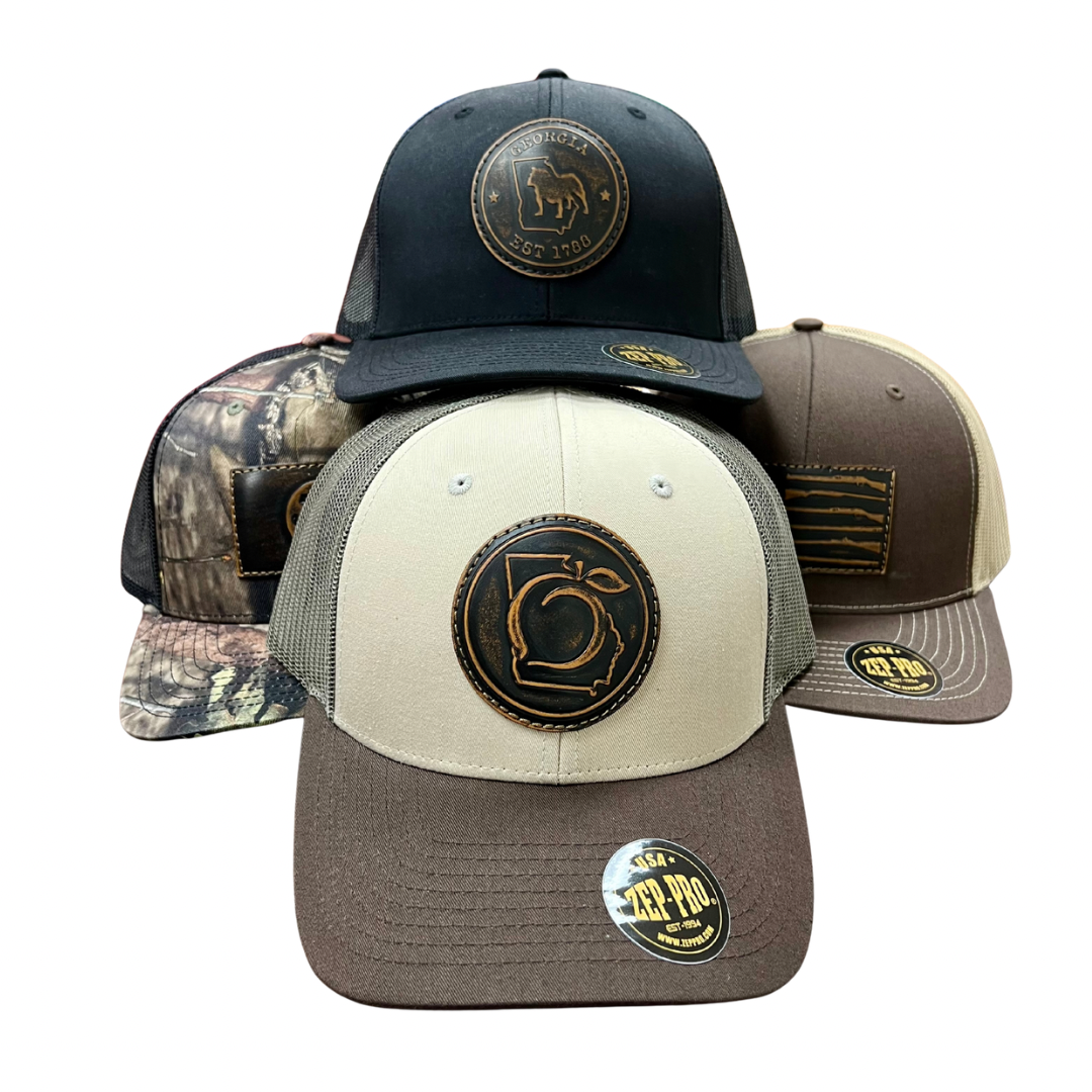 Four different hats with logos on a white background