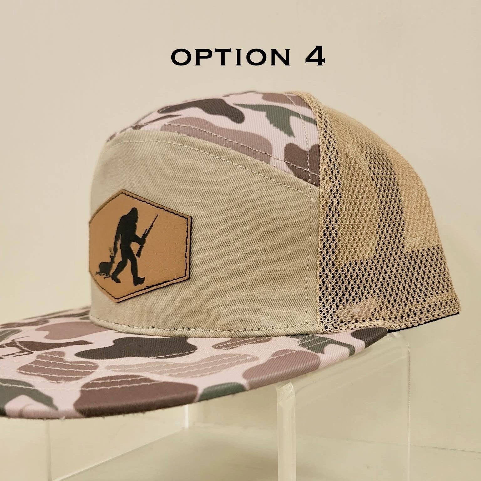 Camouflage trucker hat with a logo on a beige background